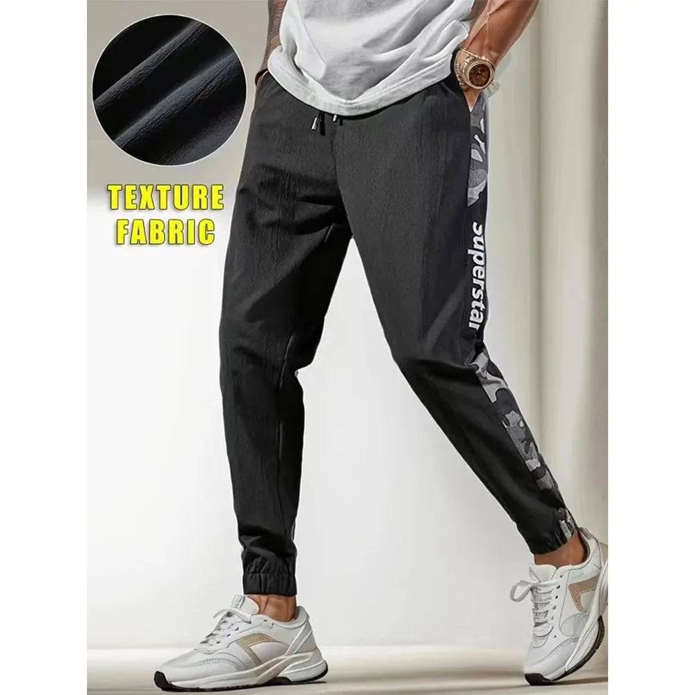 Men's Letter Print Drawstring Sweatpants Camouflage Texture Fabric Breathable Loose Fit Casual Joggers For Spring Summer Running