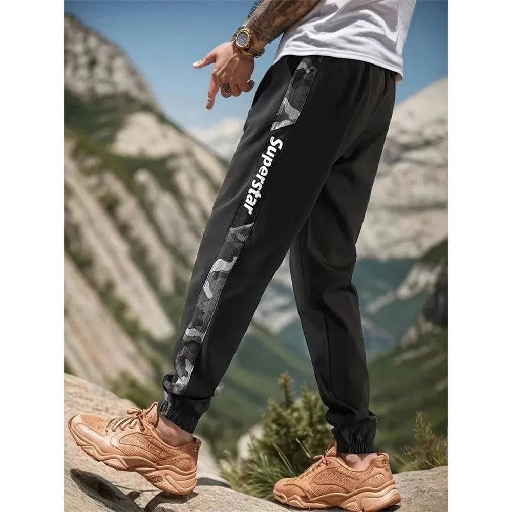 Men's Letter Print Drawstring Sweatpants Camouflage Texture Fabric Breathable Loose Fit Casual Joggers For Spring Summer Running